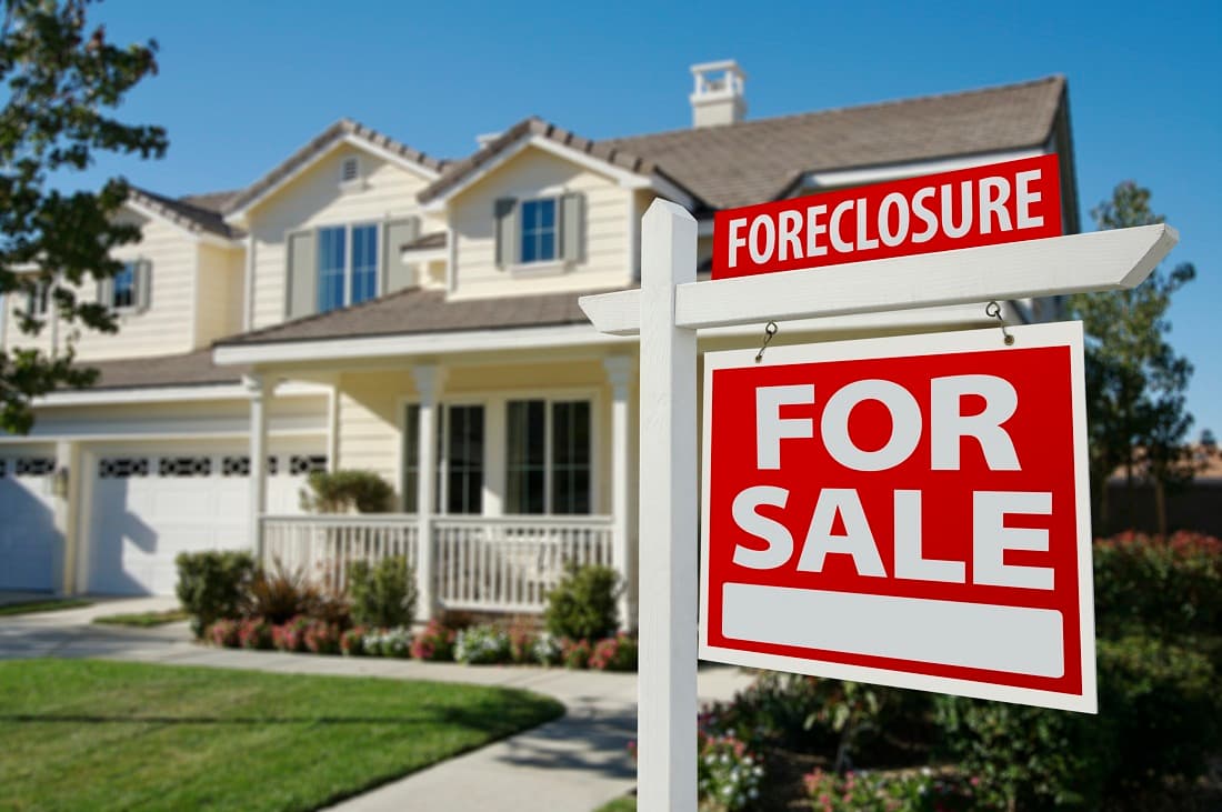 Foreclosure Home For Sale Sign and House